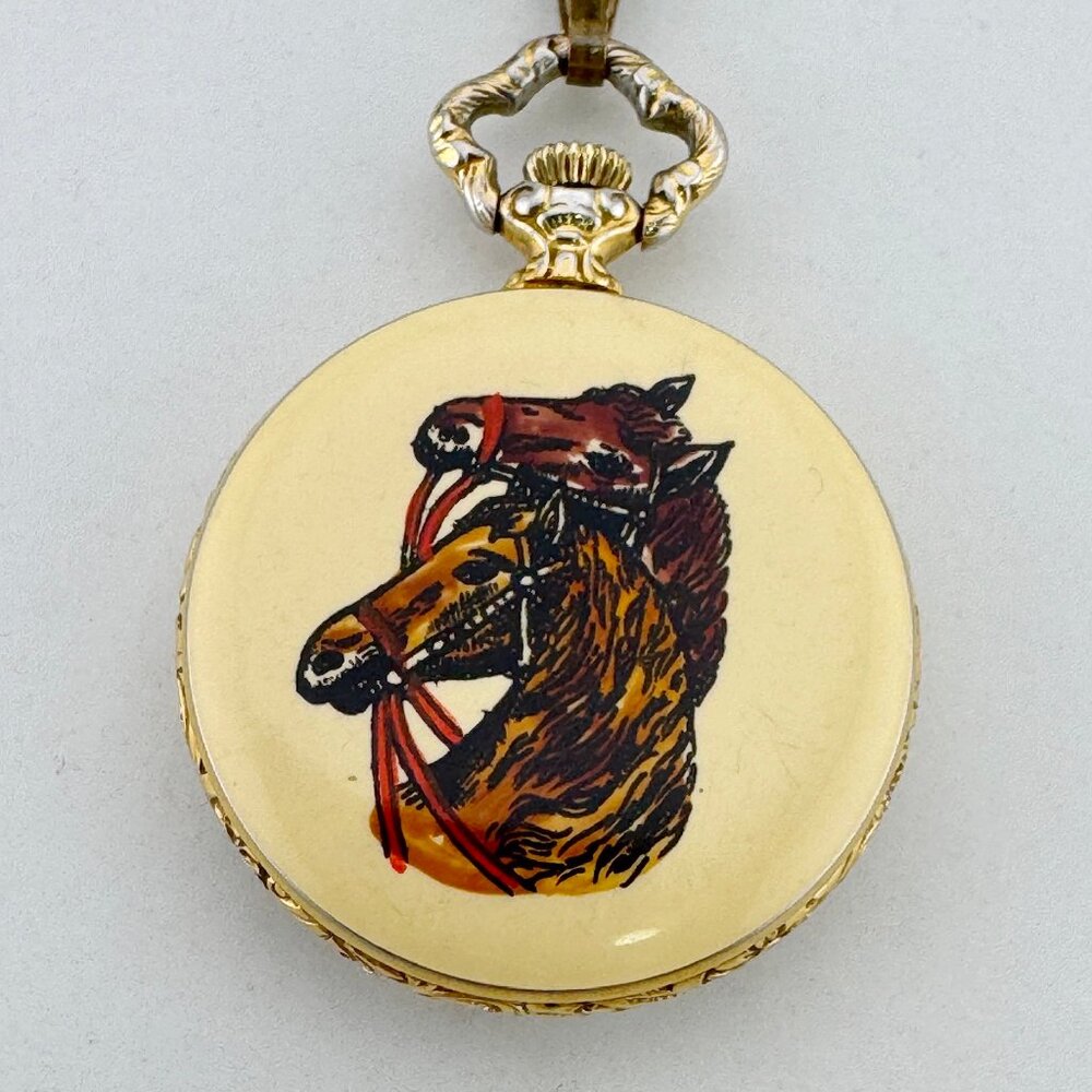 Bucherer pendant watch boasts an enamel flower bezel and a horses head design